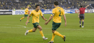 Socceroos Captain Lucas Neill with teammate during tournament