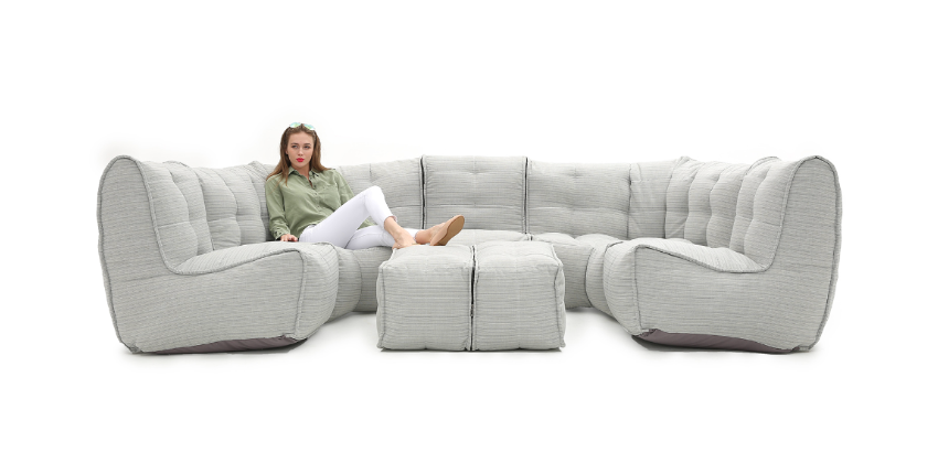 Woman sitting on an Ambient lounge Mod6 lounge max