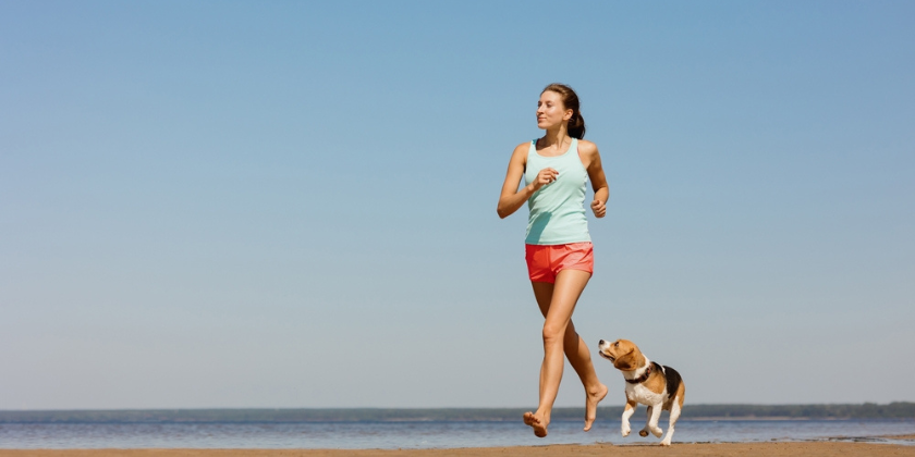 woman running with her dog 