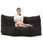 Modular bean bag corner in Black Sapphire with model relaxing